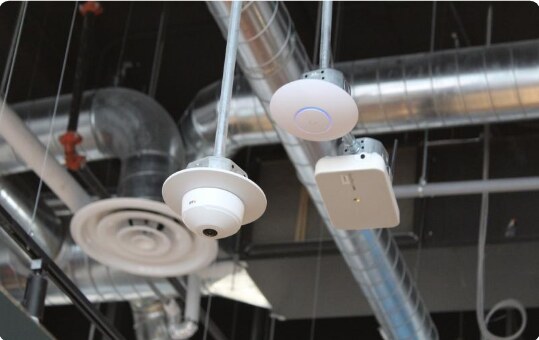 Ceiling-mounted cameras in a Farmland Foods production facility